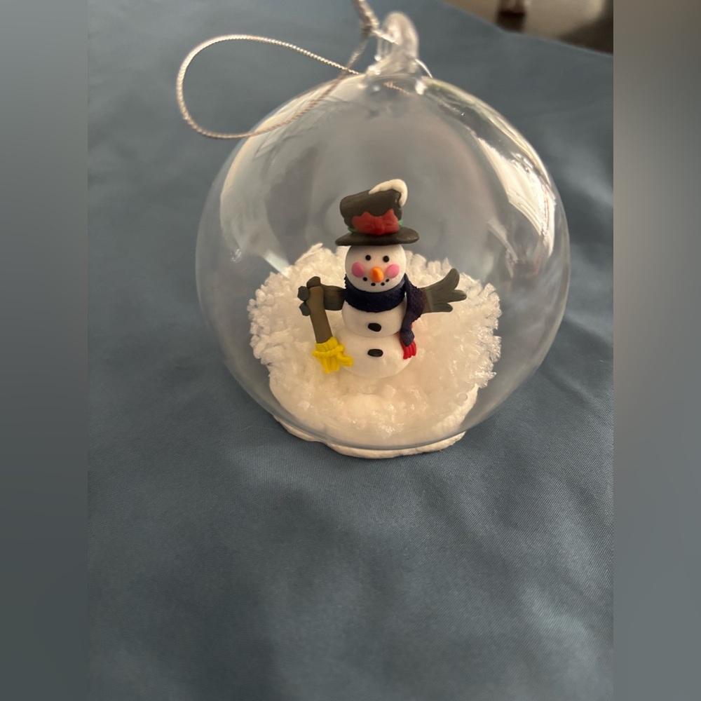 Snowman Glass Ornament with snow that moves around when you turn it. Cute!